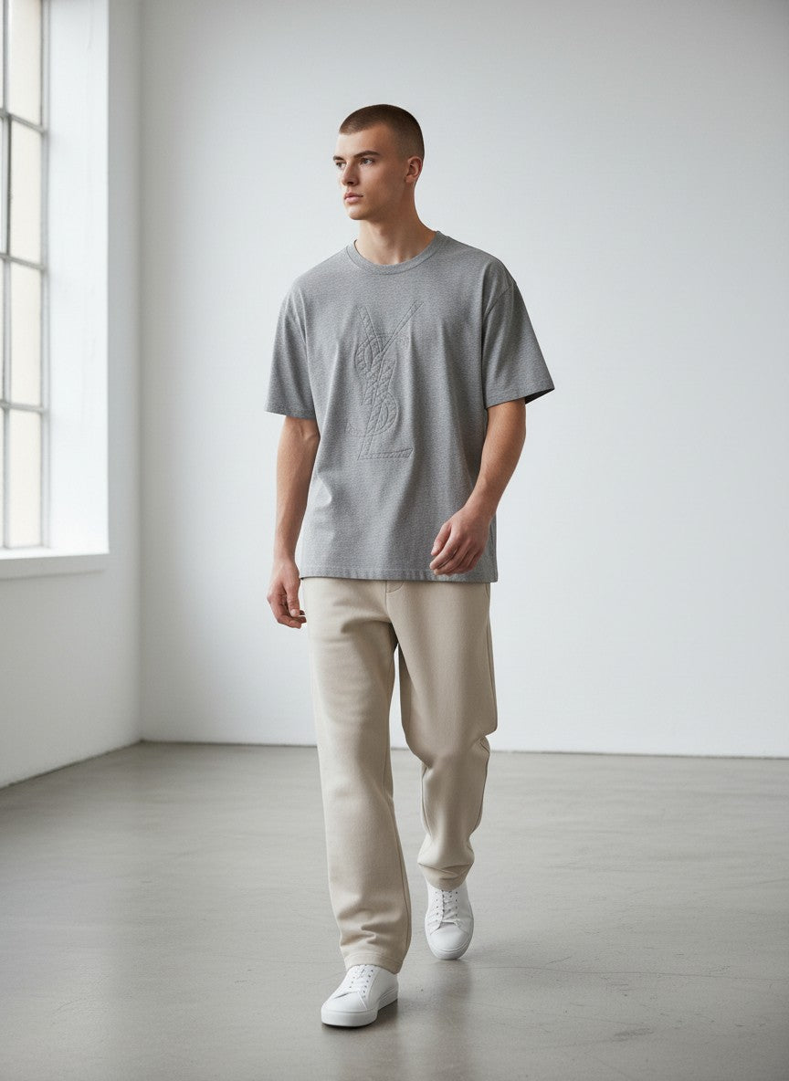 BERLIN VINTAGE CORNER grey cotton blend t-shirt with embossed quilted YSL monogram on chest. Crew neck, short sleeves.