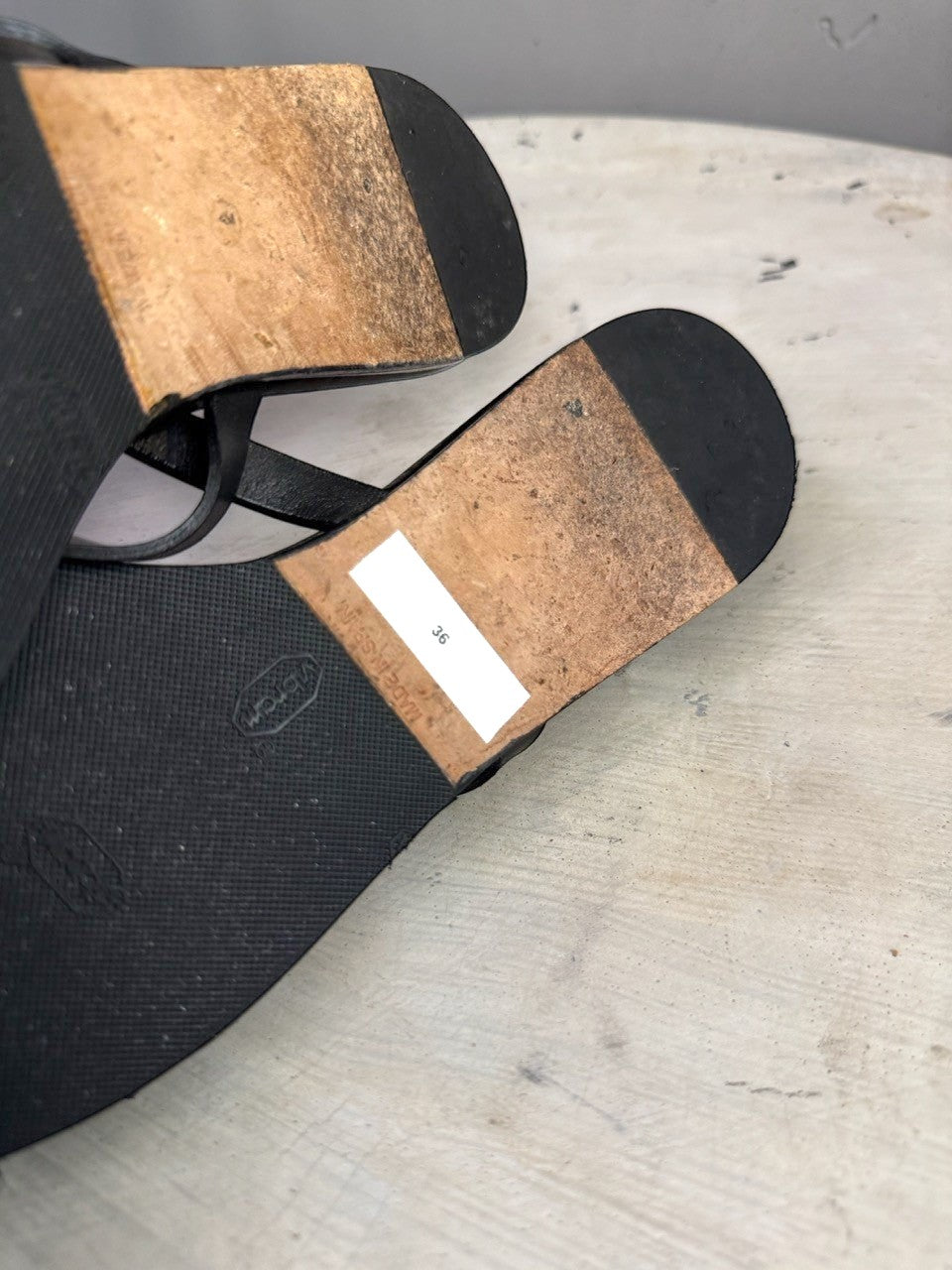 BERLIN VINTAGE CORNER HERMÈS PARIS black leather thong sandals showing the durable Vibram soles and size 36 label