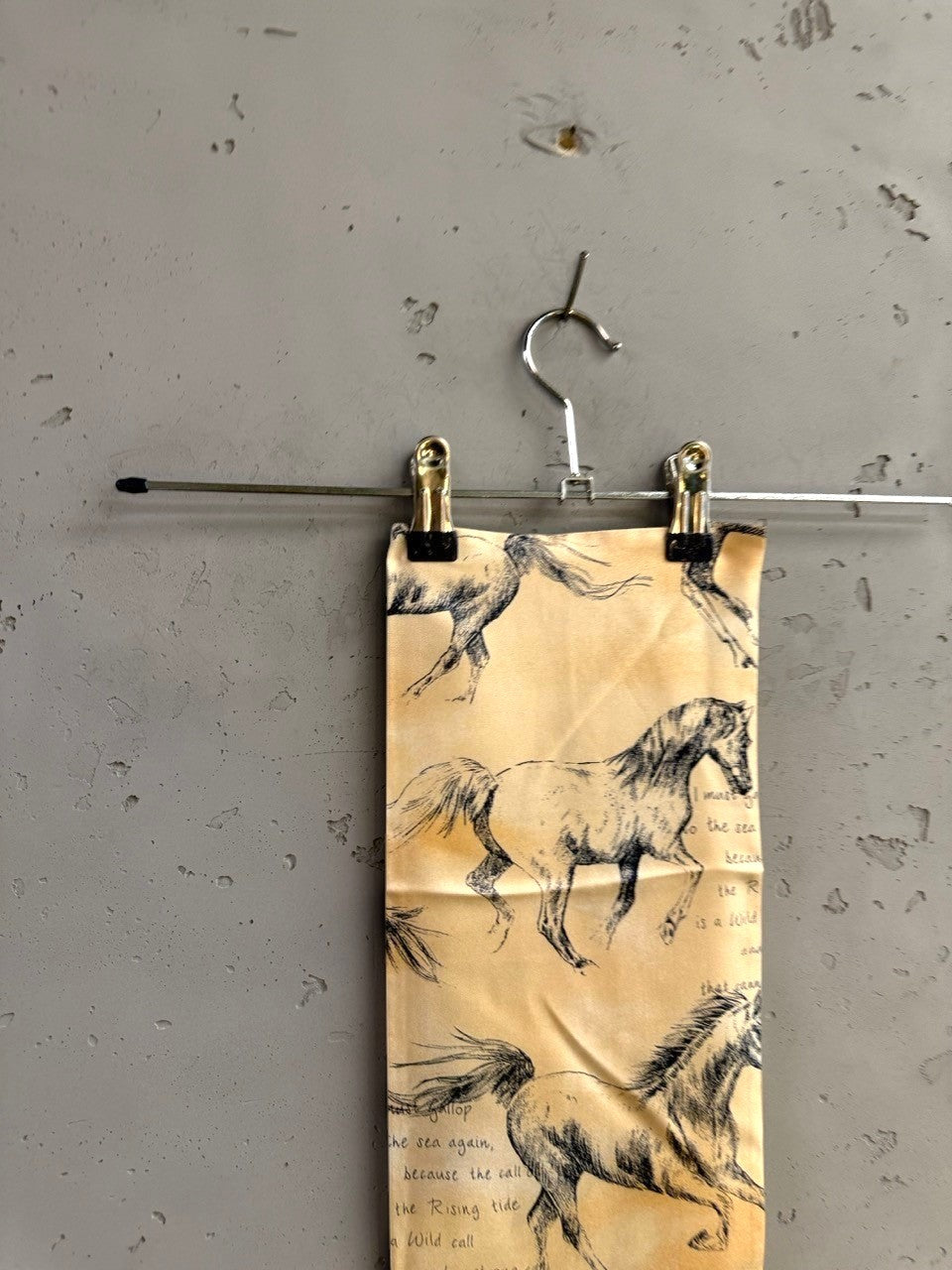 BERLIN VINTAGE CORNER skinny silk scarf in golden-tan with charcoal horse sketches and poetic script text.