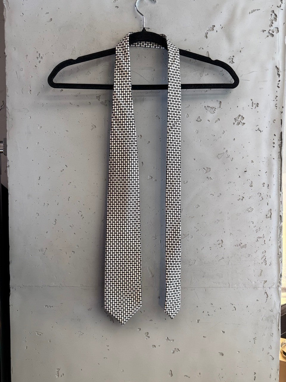 BERLIN VINTAGE CORNER black and white micro-dot patterned necktie made from high-quality fabric.