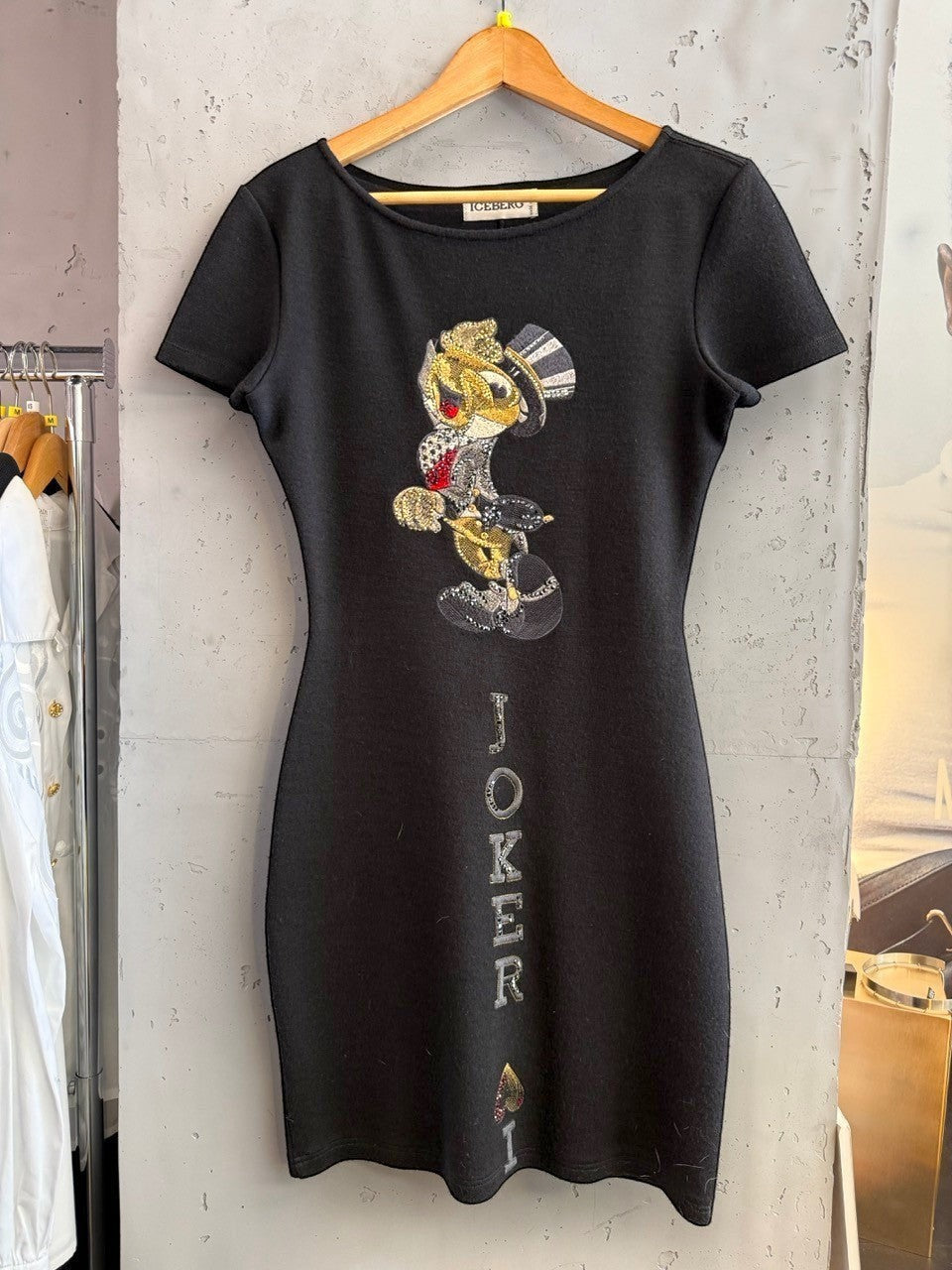 BERLIN VINTAGE CORNER black short sleeve mini dress with a sequined Joker graphic and rhinestone text.