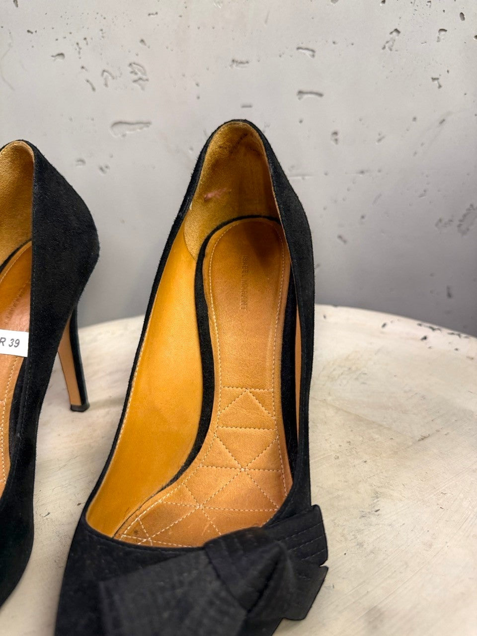 BERLIN VINTAGE CORNER Isabel Marant black suede stiletto heels with a pointed toe and decorative bow detail.