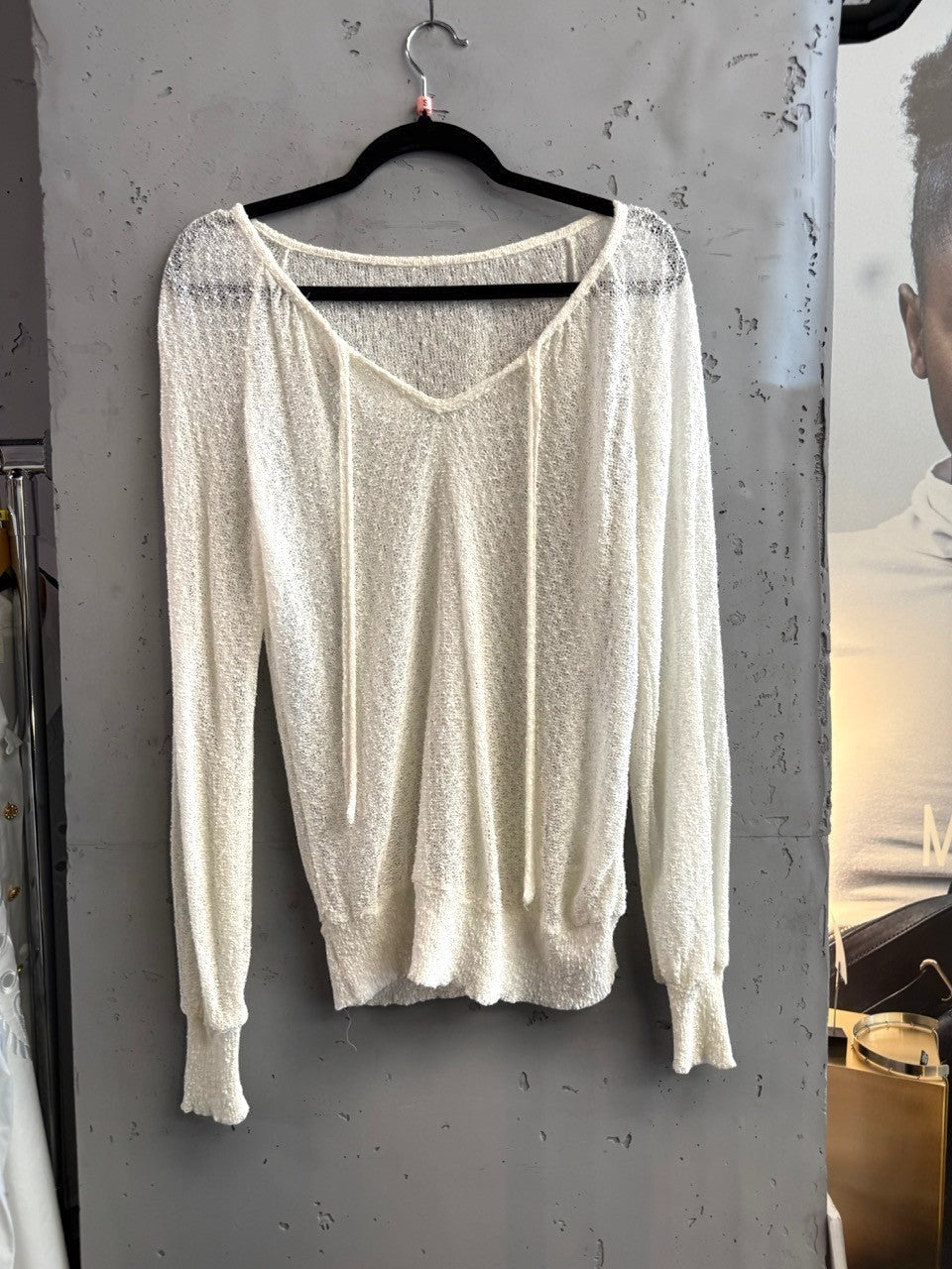 BERLIN VINTAGE CORNER ivory sheer knit long sleeve V-neck pullover sweater with drawstring detail.