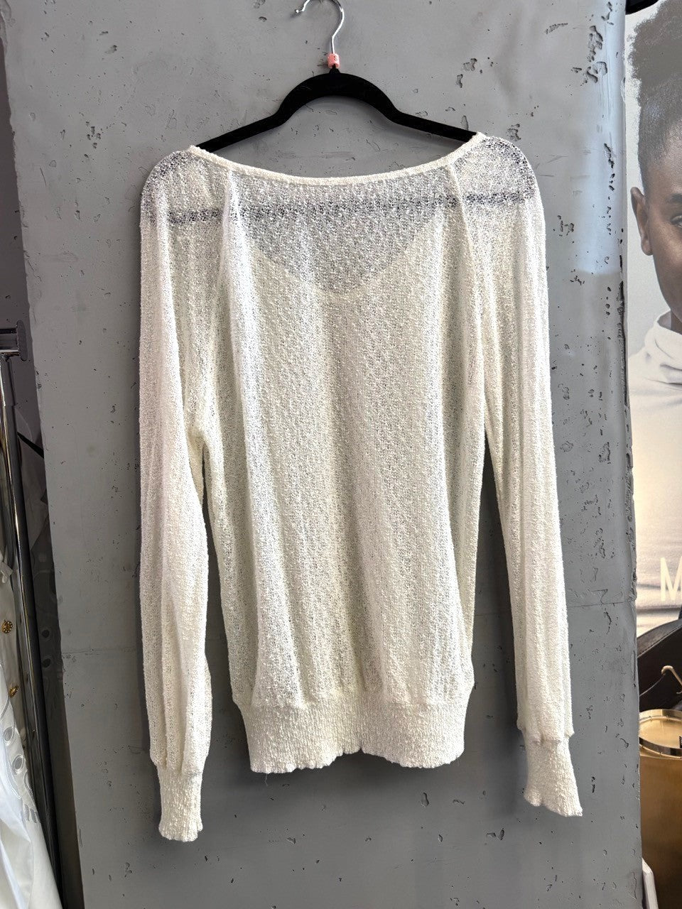 BERLIN VINTAGE CORNER ivory sheer knit V-neck pullover sweater with textured fabric and ribbed cuffs.