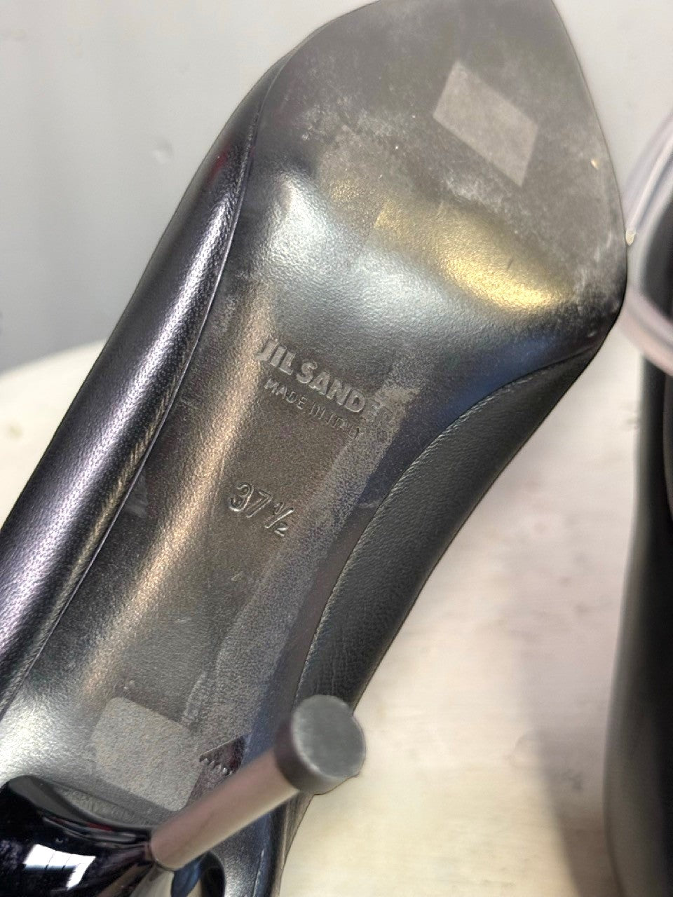 BERLIN VINTAGE CORNER Jil Sander black leather stiletto pump showing the interior sole with size 37.5 branding