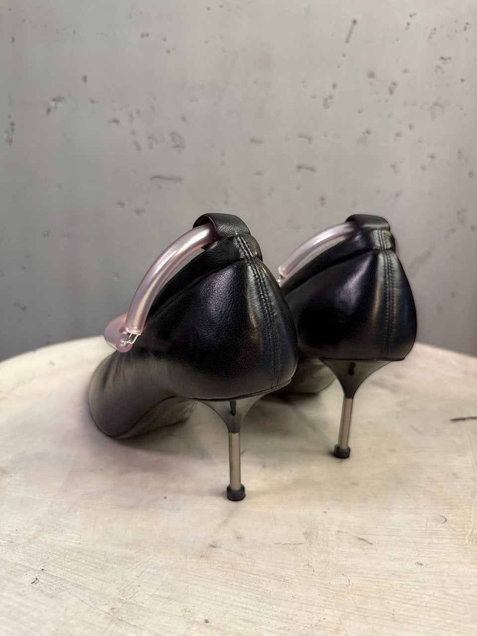 BERLIN VINTAGE CORNER Jil Sander black leather stiletto pumps with a translucent sculptural ankle ring detail.