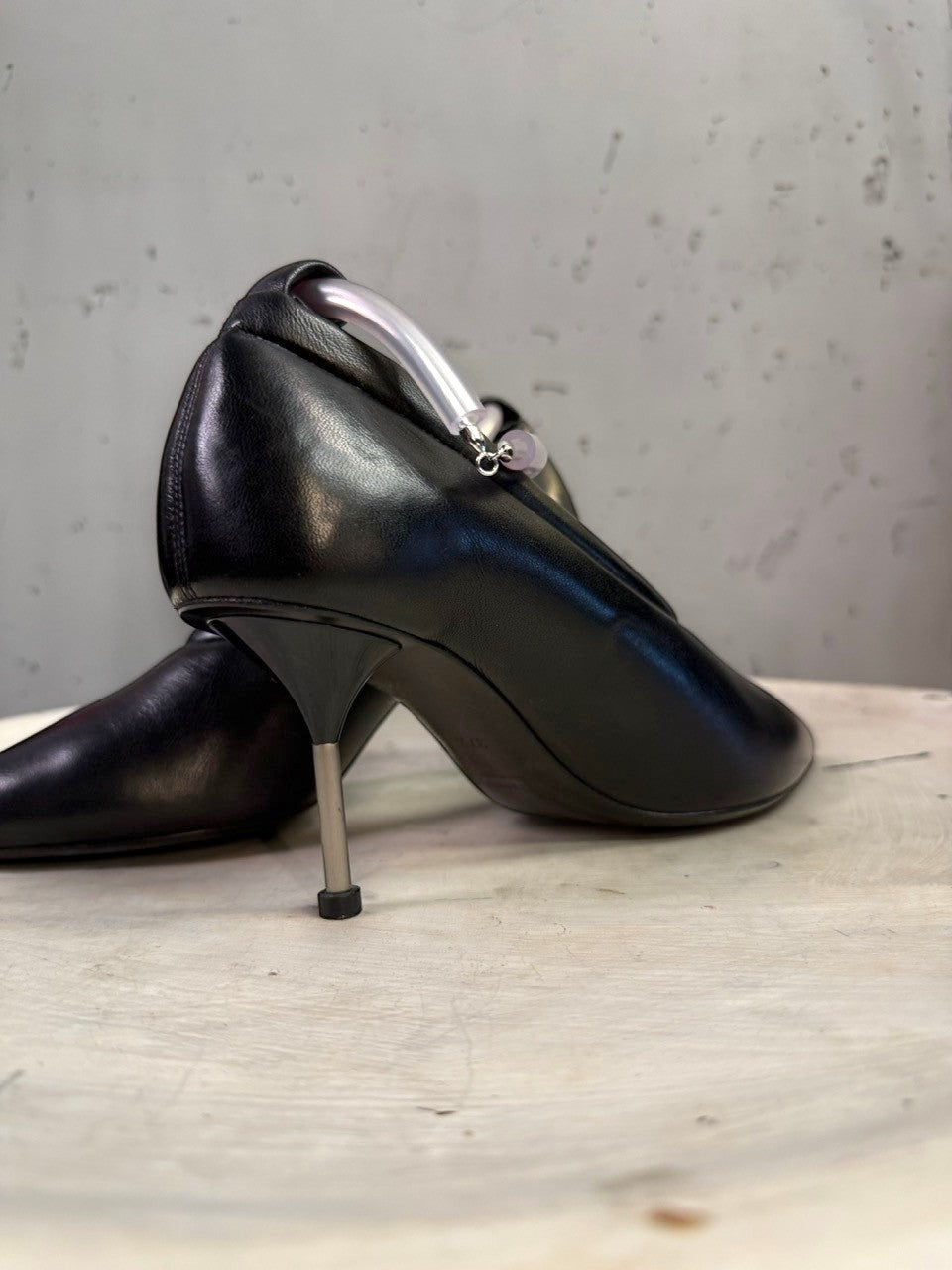 BERLIN VINTAGE CORNER Jil Sander black leather stiletto pumps with a unique translucent sculptural ankle ring detail.