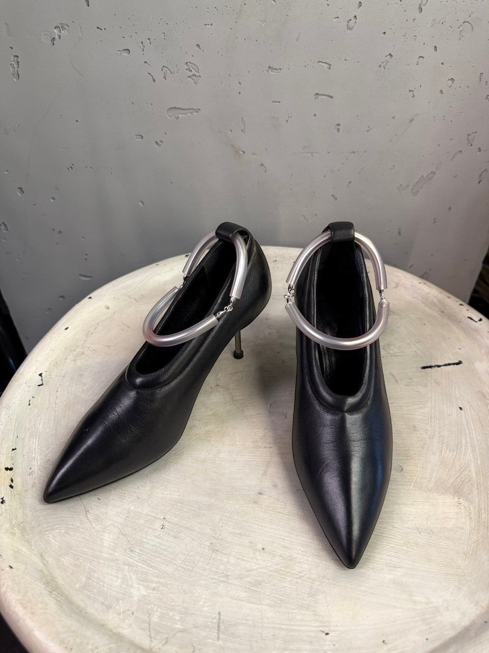 BERLIN VINTAGE CORNER Jil Sander black leather pointed-toe pumps with unique translucent sculptural ankle rings.