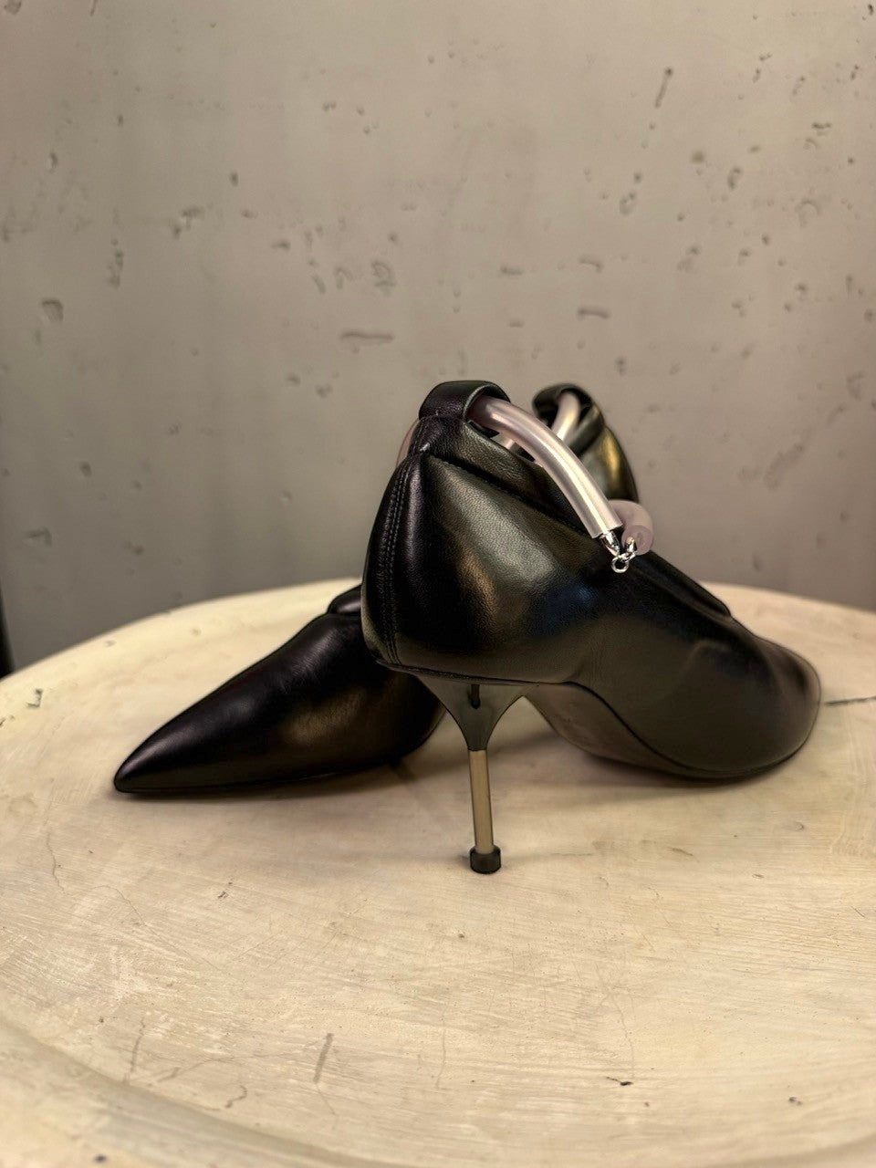 BERLIN VINTAGE CORNER Jil Sander black leather pointed-toe pumps with a unique translucent sculptural ankle ring.