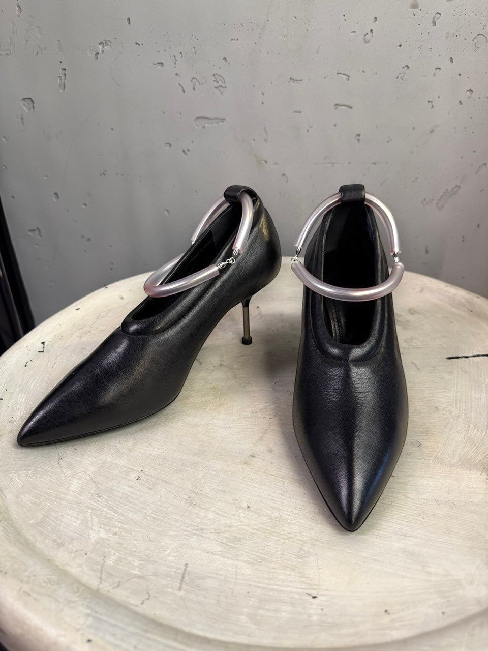 BERLIN VINTAGE CORNER Jil Sander black leather pointed-toe pumps with unique translucent sculptural ankle ring detail.