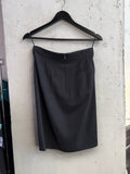 BERLIN VINTAGE CORNER JIL SANDER black tailored pencil skirt with back zipper and dart detailing on a hanger