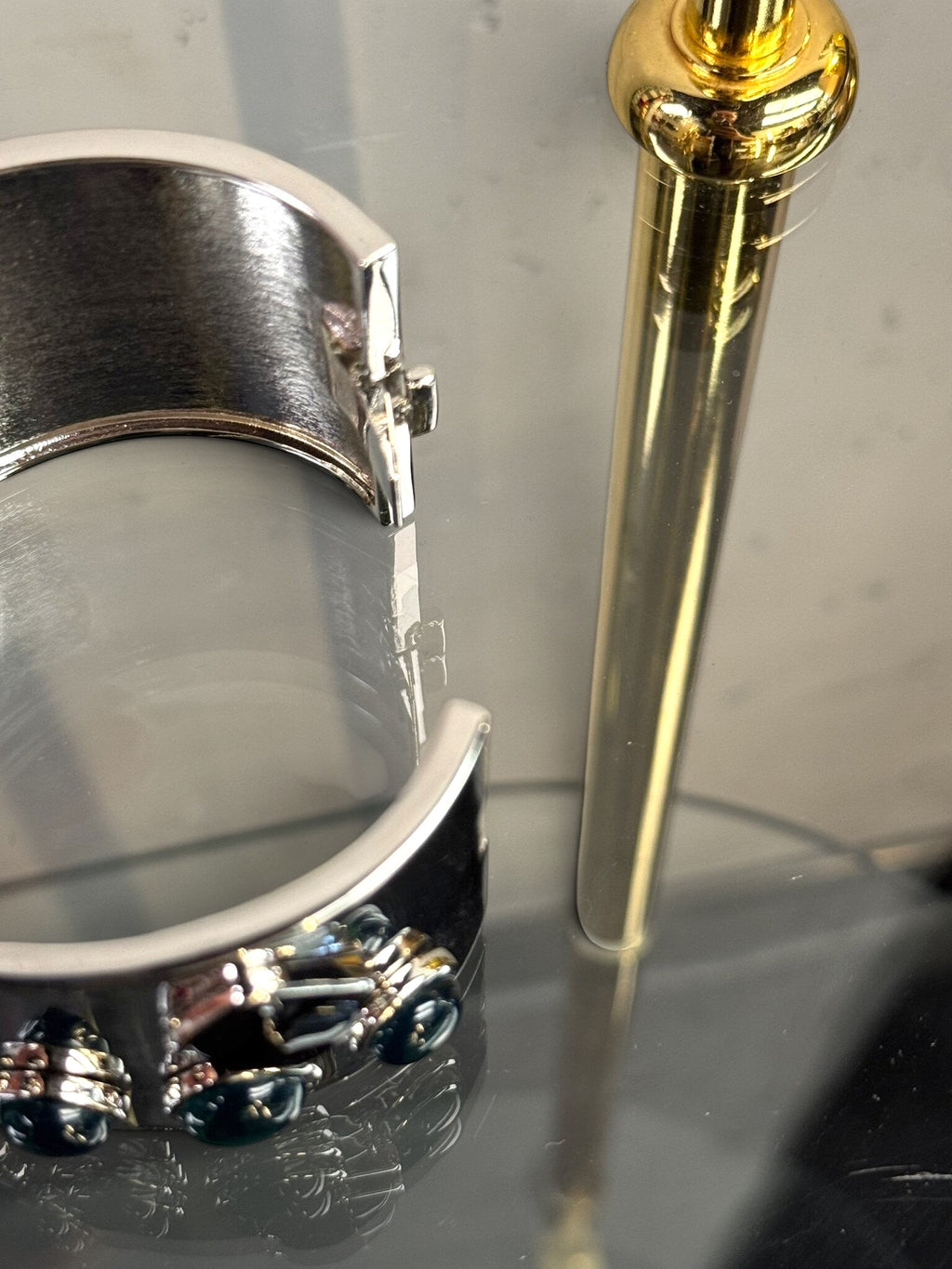 BERLIN VINTAGE CORNER Jil Sander wide silver-tone hinged cuff bracelet with dark jewel-toned stone accents.