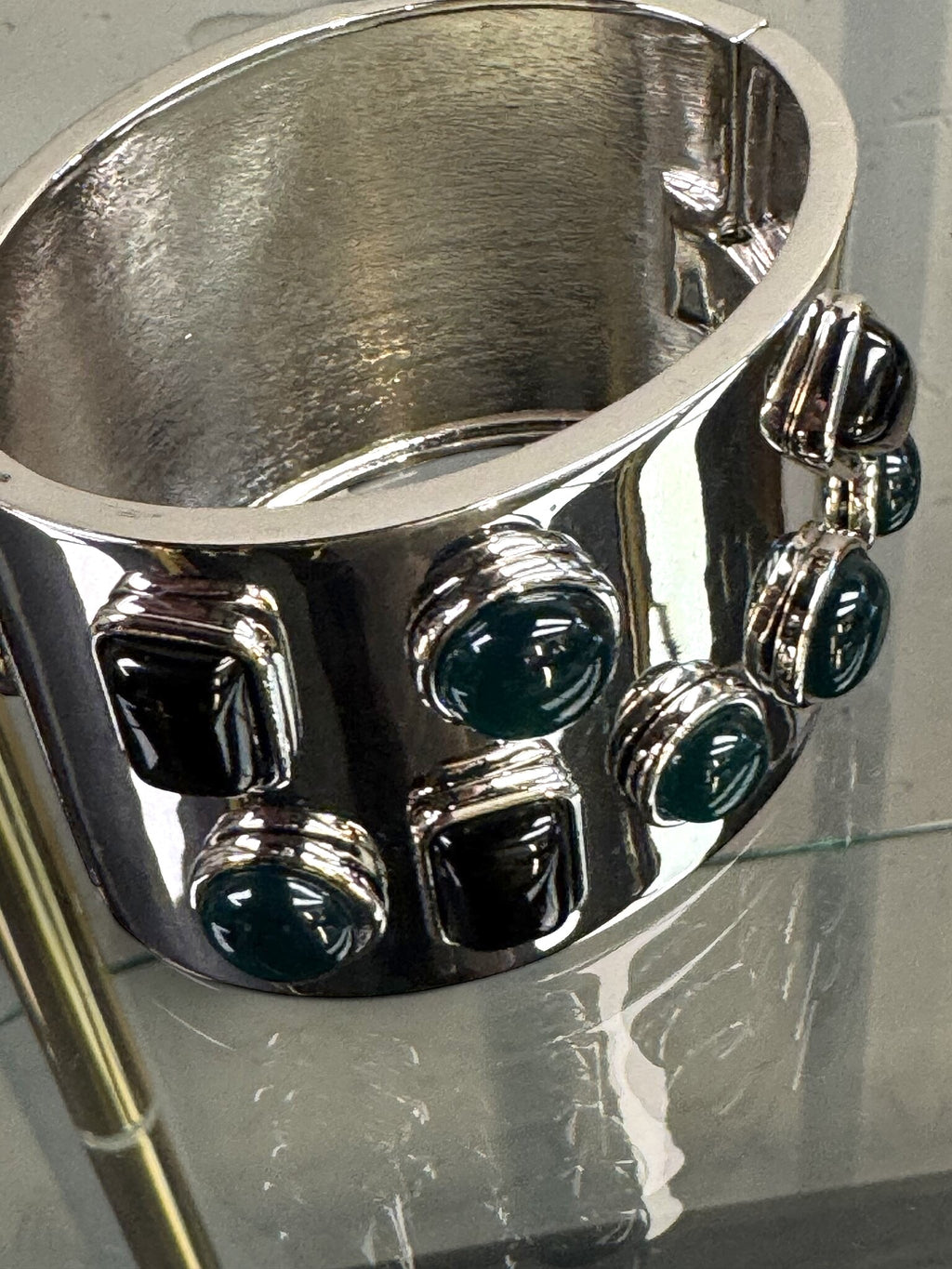 BERLIN VINTAGE CORNER Jil Sander wide silver-tone hinged cuff bracelet with alternating dark jewel-toned stones.