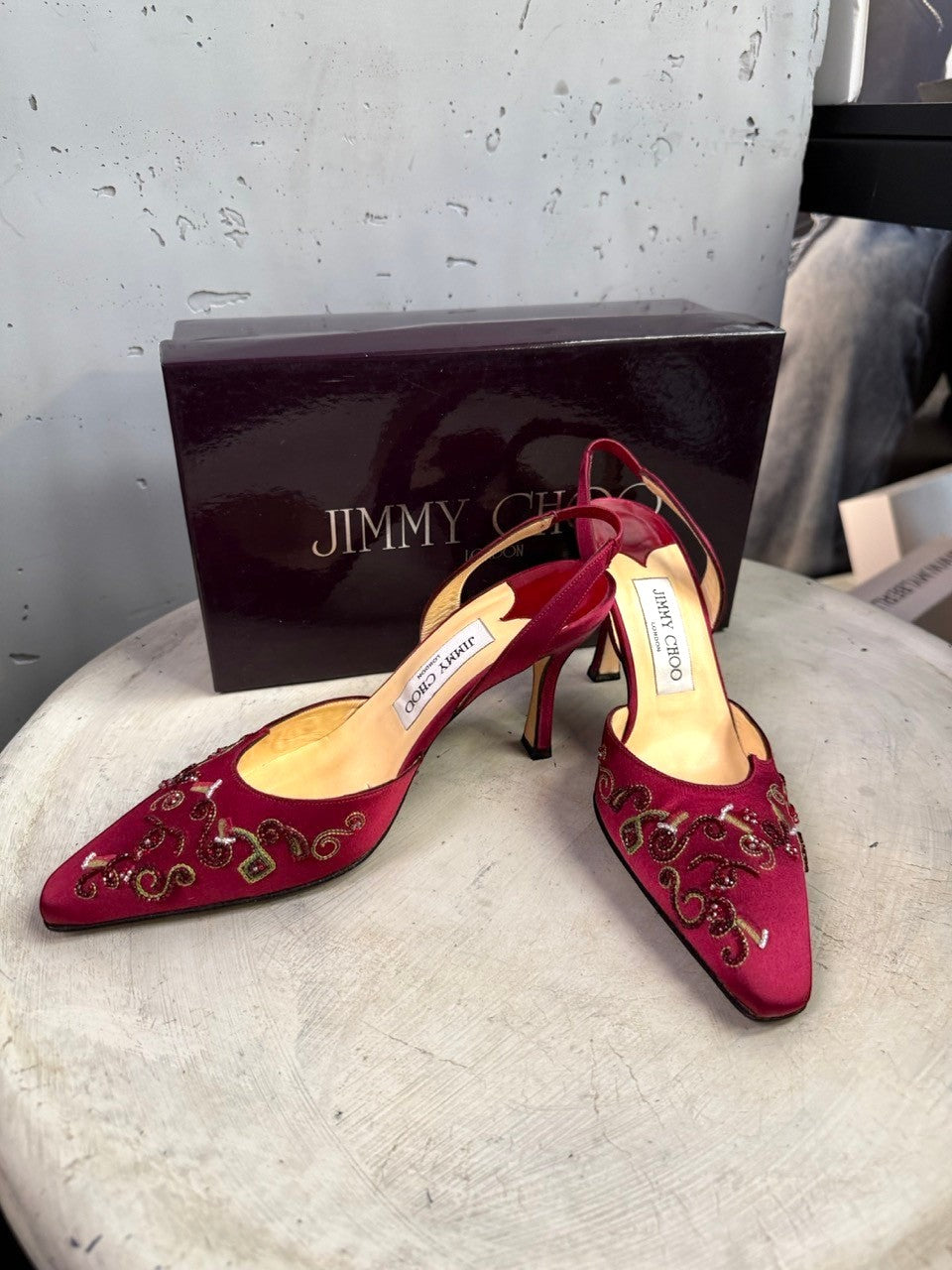 BERLIN VINTAGE CORNER Jimmy Choo burgundy satin slingback heels with intricate beadwork and pointed toes.