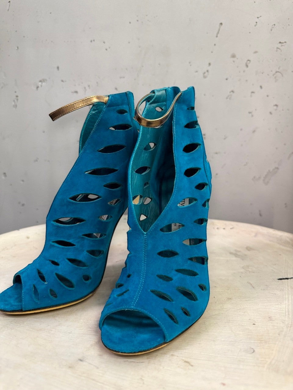 BERLIN VINTAGE CORNER Jimmy Choo teal blue suede peep-toe booties with laser-cut details and gold ankle straps.