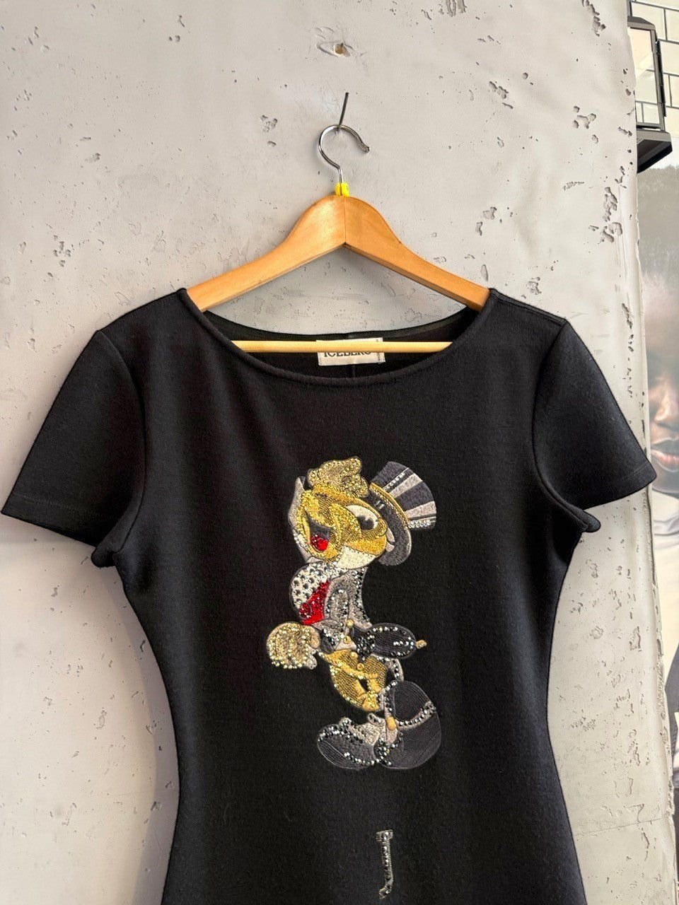 BERLIN VINTAGE CORNER black short sleeve mini dress with a jeweled cartoon character graphic and "JOKER" text.