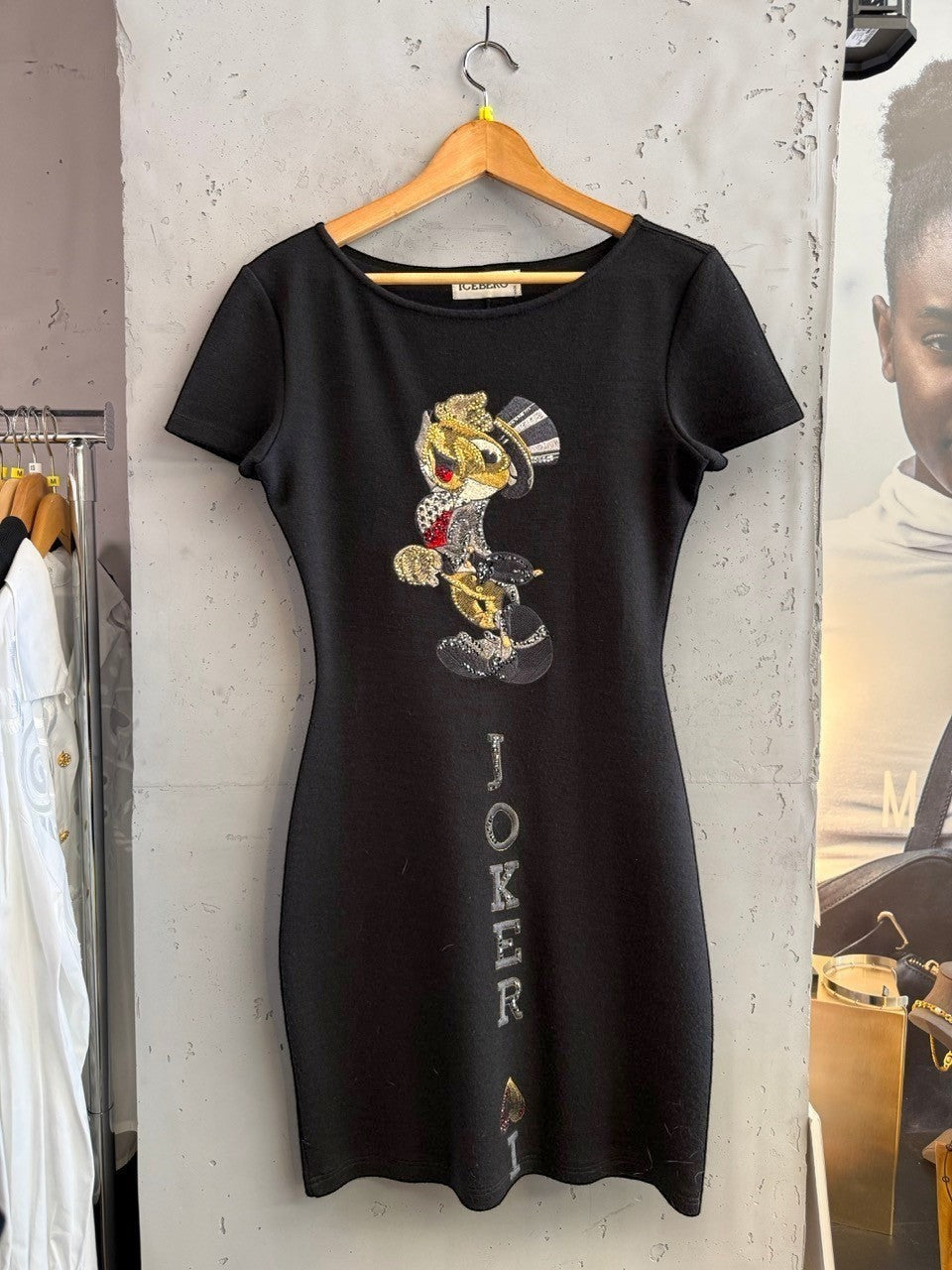 BERLIN VINTAGE CORNER black short sleeve mini dress with Joker graphic and rhinestone embellishments.