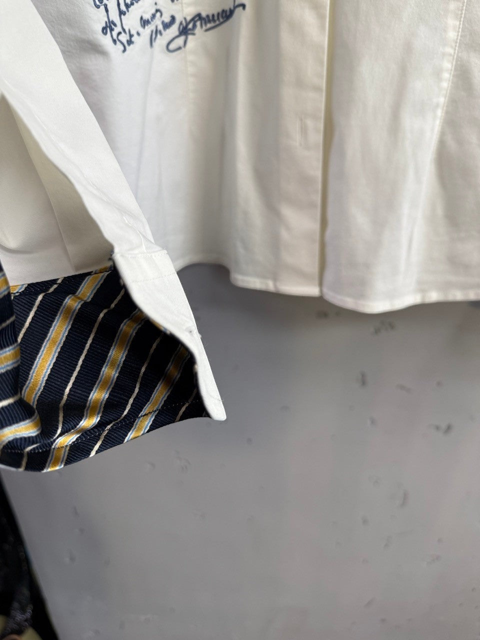 BERLIN VINTAGE CORNER white La Martina cotton button-down shirt with navy, yellow, and white striped cuff detail.