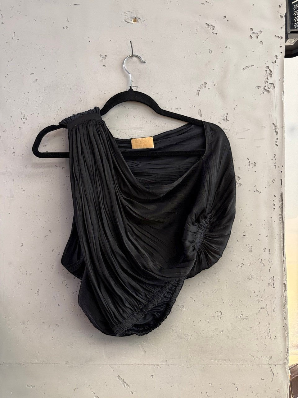 BERLIN VINTAGE CORNER Lanvin black one-shoulder top with micro-pleated texture and sculptural draped detailing.
