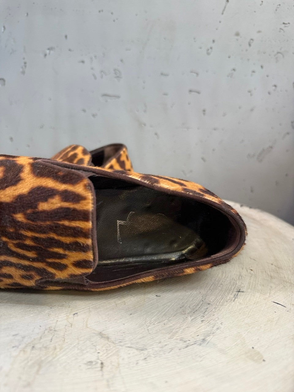 BERLIN VINTAGE CORNER leopard print calf hair loafers with slip-on design and dark brown trim.
