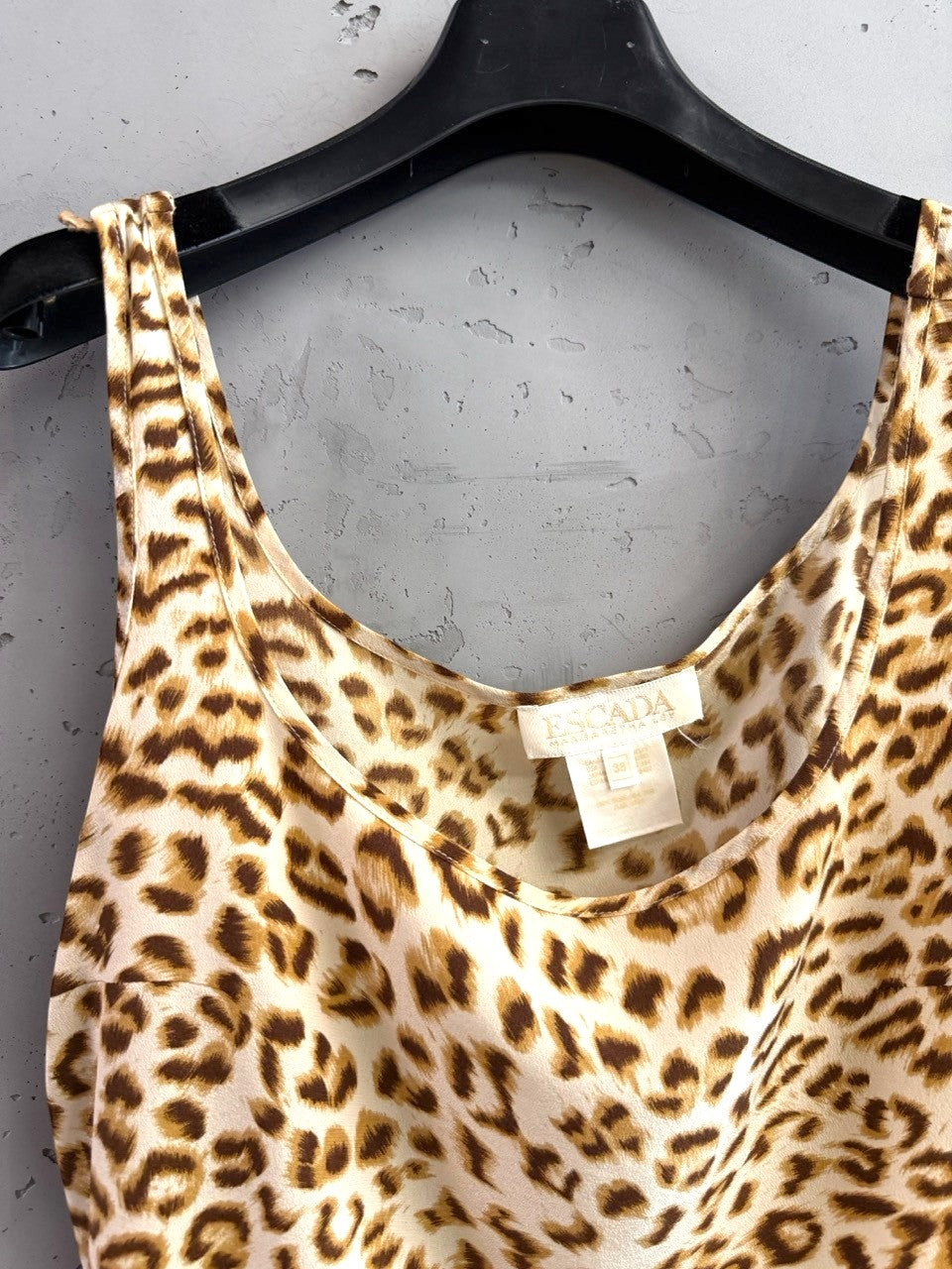 BERLIN VINTAGE CORNER leopard print camisole top with adjustable spaghetti straps and scoop neckline.
