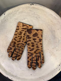 BERLIN VINTAGE CORNER leopard print leather gloves with black trim and lining.