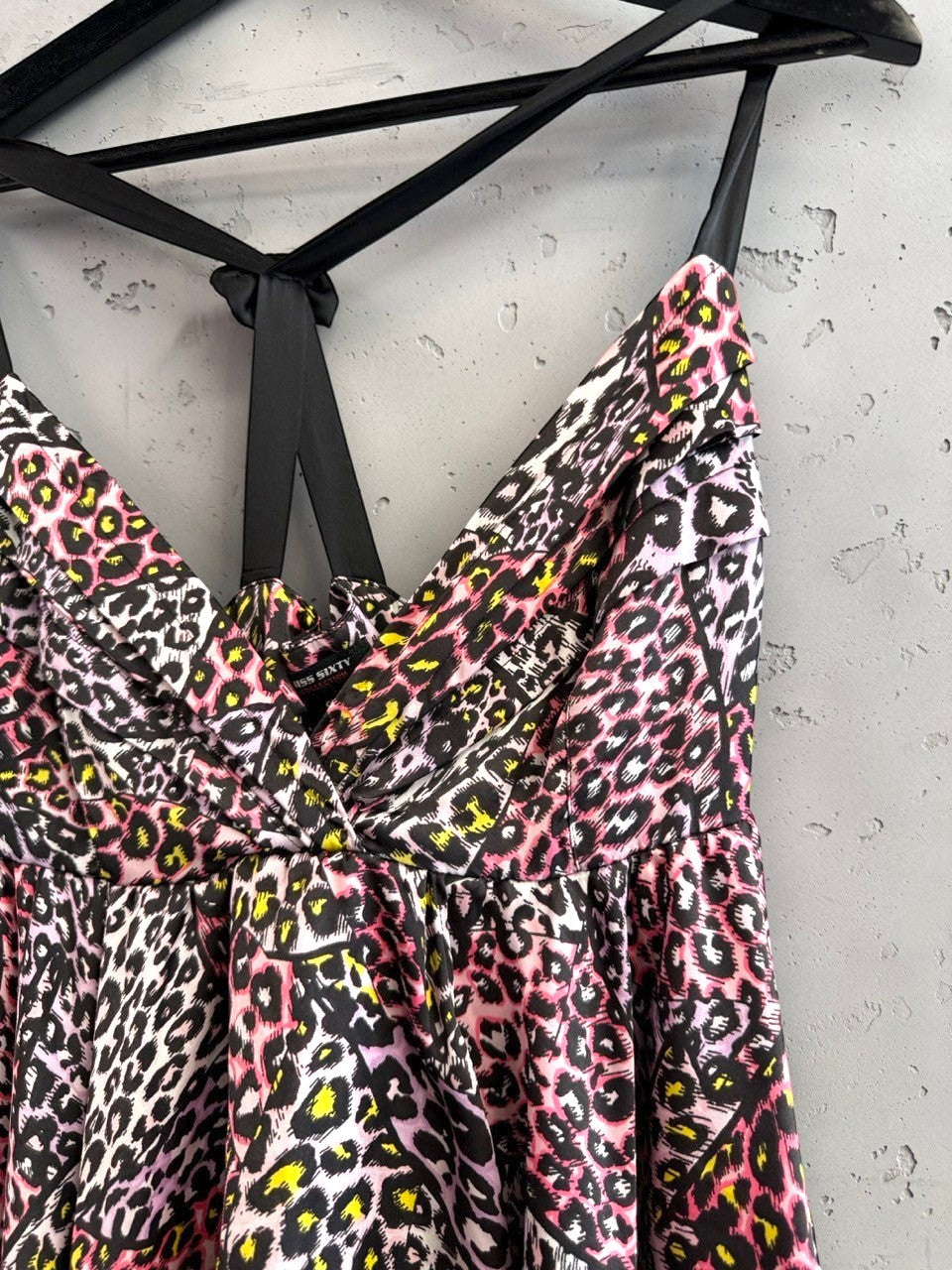BERLIN VINTAGE CORNER pink, purple, yellow leopard print tiered mini dress with spaghetti straps and gathered bust.