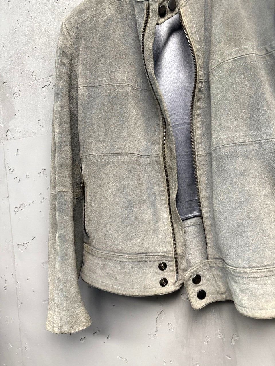 BERLIN VINTAGE CORNER light grey suede moto jacket with zip-front closure and zippered pockets.