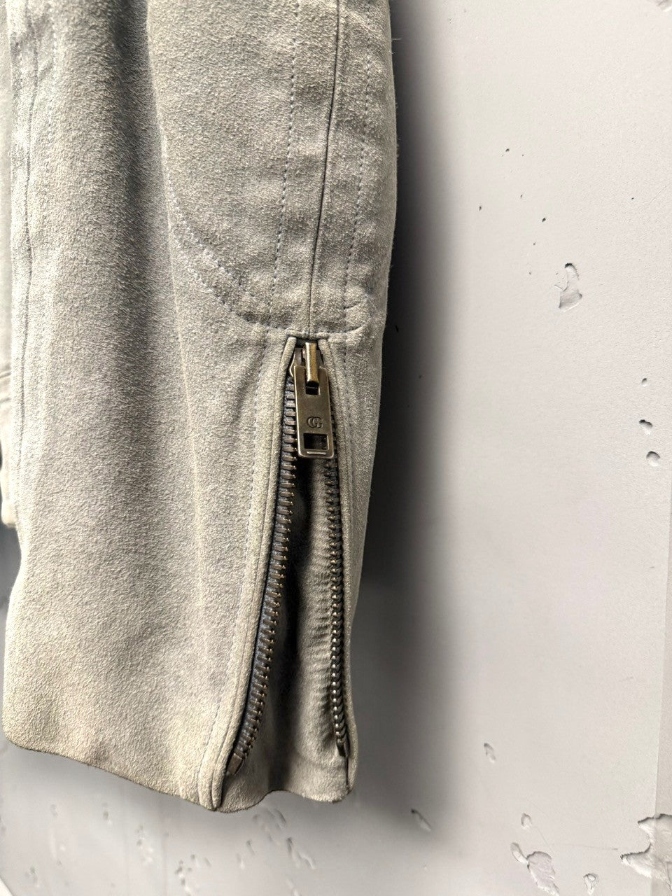 BERLIN VINTAGE CORNER light grey suede moto jacket with zippered pocket detail and stand-up collar.