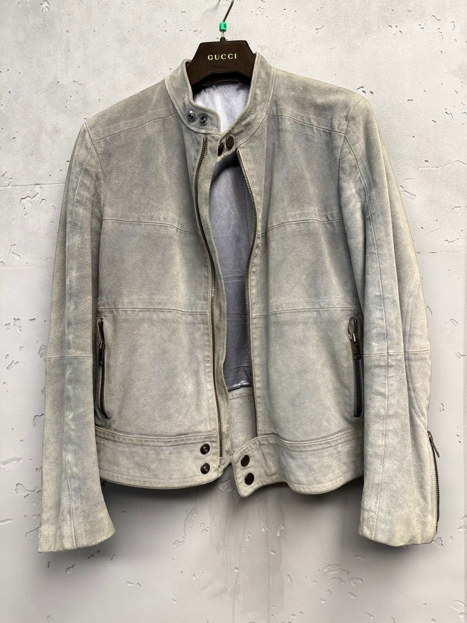 BERLIN VINTAGE CORNER light grey suede moto jacket with zip-front, zippered pockets, and stand-up collar.