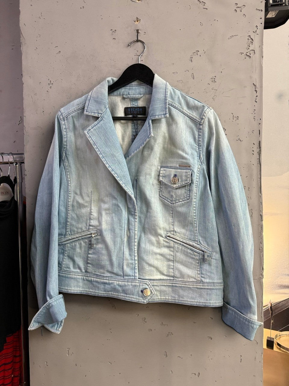 BERLIN VINTAGE CORNER light wash denim blazer jacket with button front, chest flap pocket, and zippered side pockets.