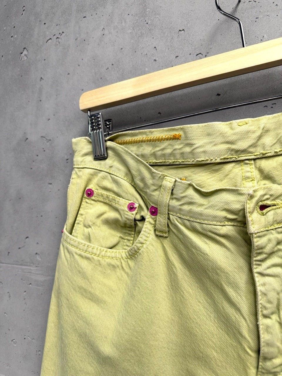 BERLIN VINTAGE CORNER light yellow denim flare jeans with embroidered paisley design and pink hardware.
