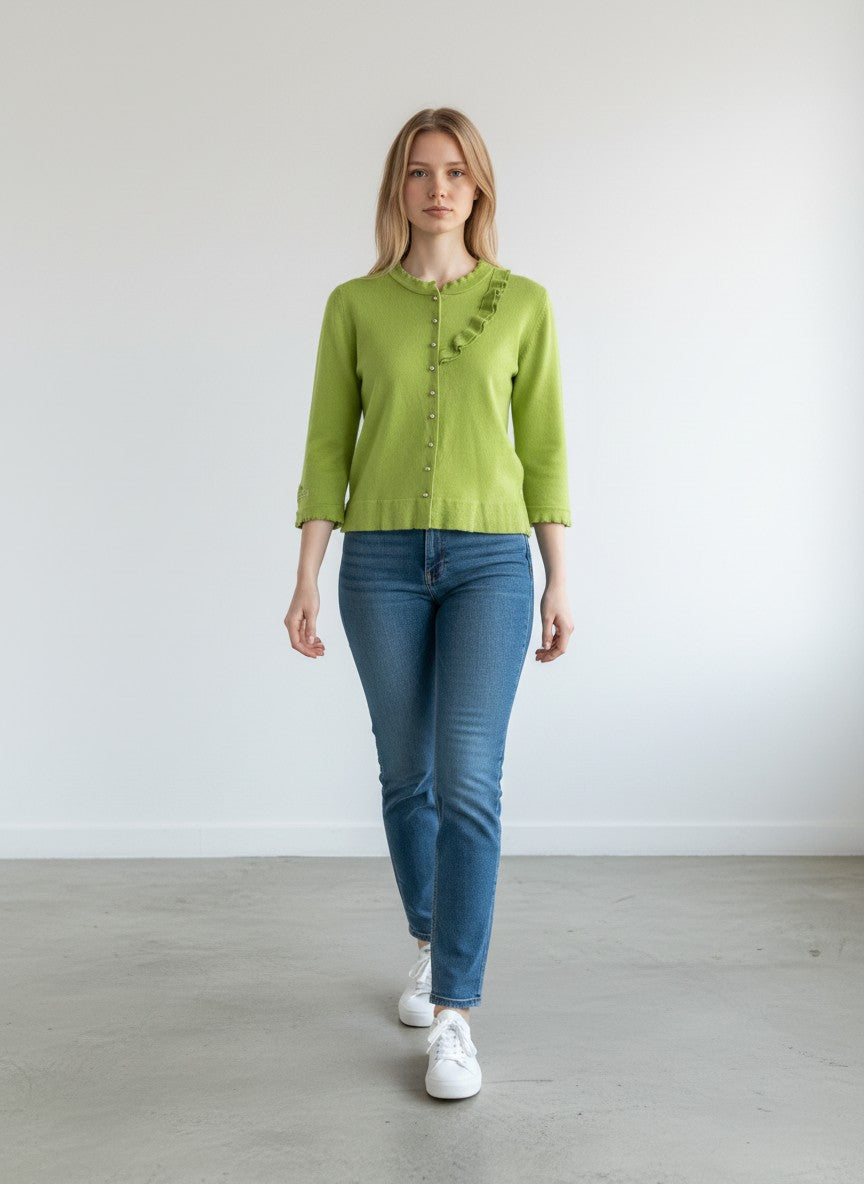 BERLIN VINTAGE CORNER lime green knit cardigan with ruffled neckline, silver buttons, and embroidered logo on sleeve.