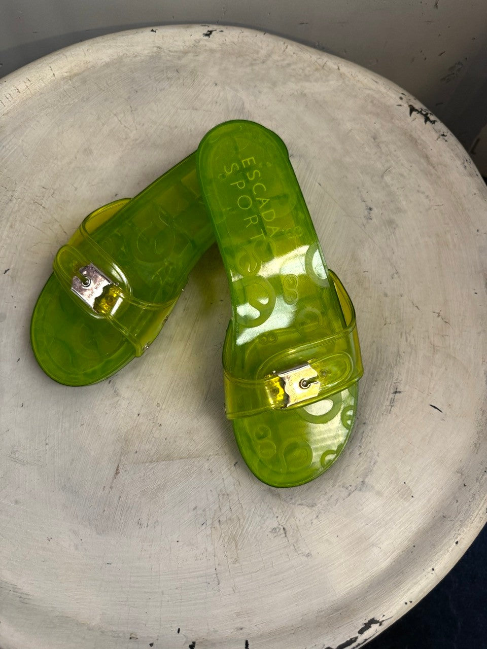 BERLIN VINTAGE CORNER lime green PVC jelly slide sandals with silver buckle and embossed logo.