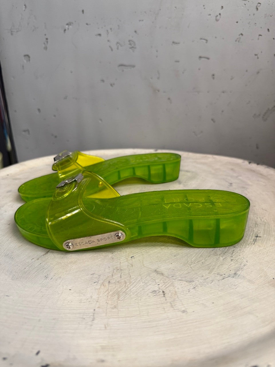 BERLIN VINTAGE CORNER lime green PVC jelly slide sandals with silver buckle and wood grain textured sole.