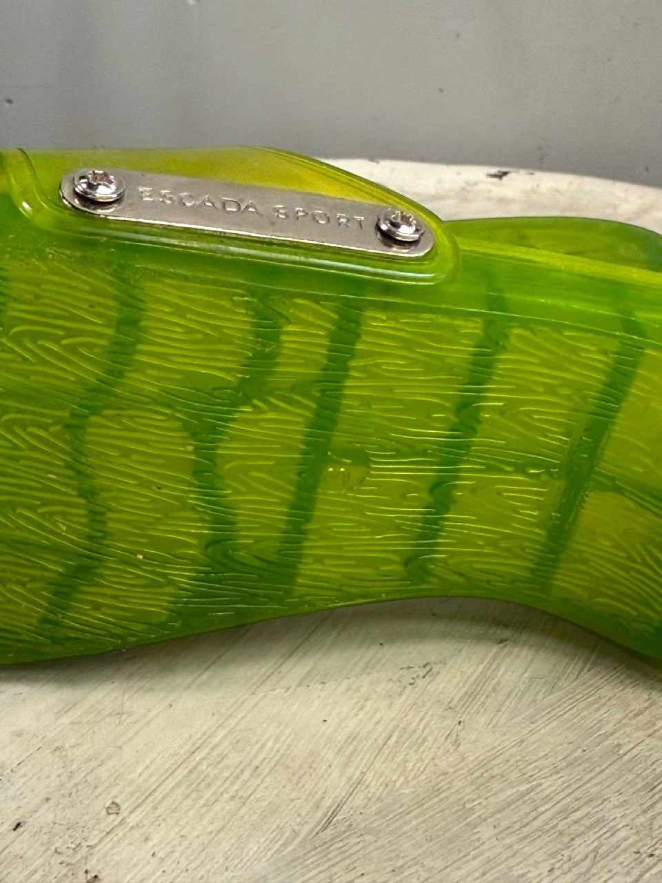 BERLIN VINTAGE CORNER lime green PVC jelly slides with wood grain texture and silver buckle.