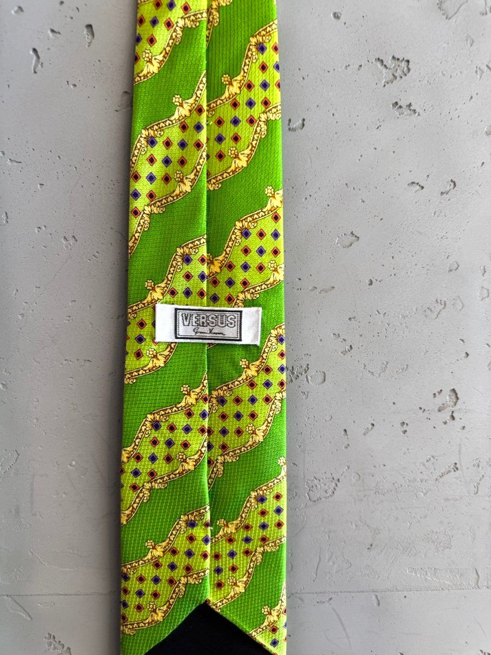 BERLIN VINTAGE CORNER lime green silk tie with gold baroque pattern and blue/red diamond accents.