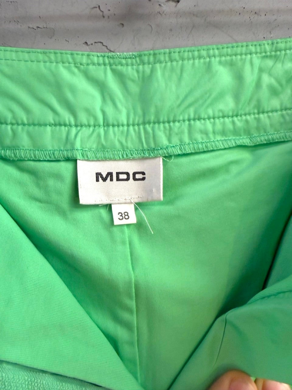 BERLIN VINTAGE CORNER lime green pleated mini skirt with MDC brand label and size 38 tag