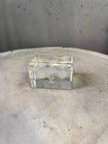 BERLIN VINTAGE CORNER Louis Vuitton crystal cube paperweight with etched monogram and floral motifs.