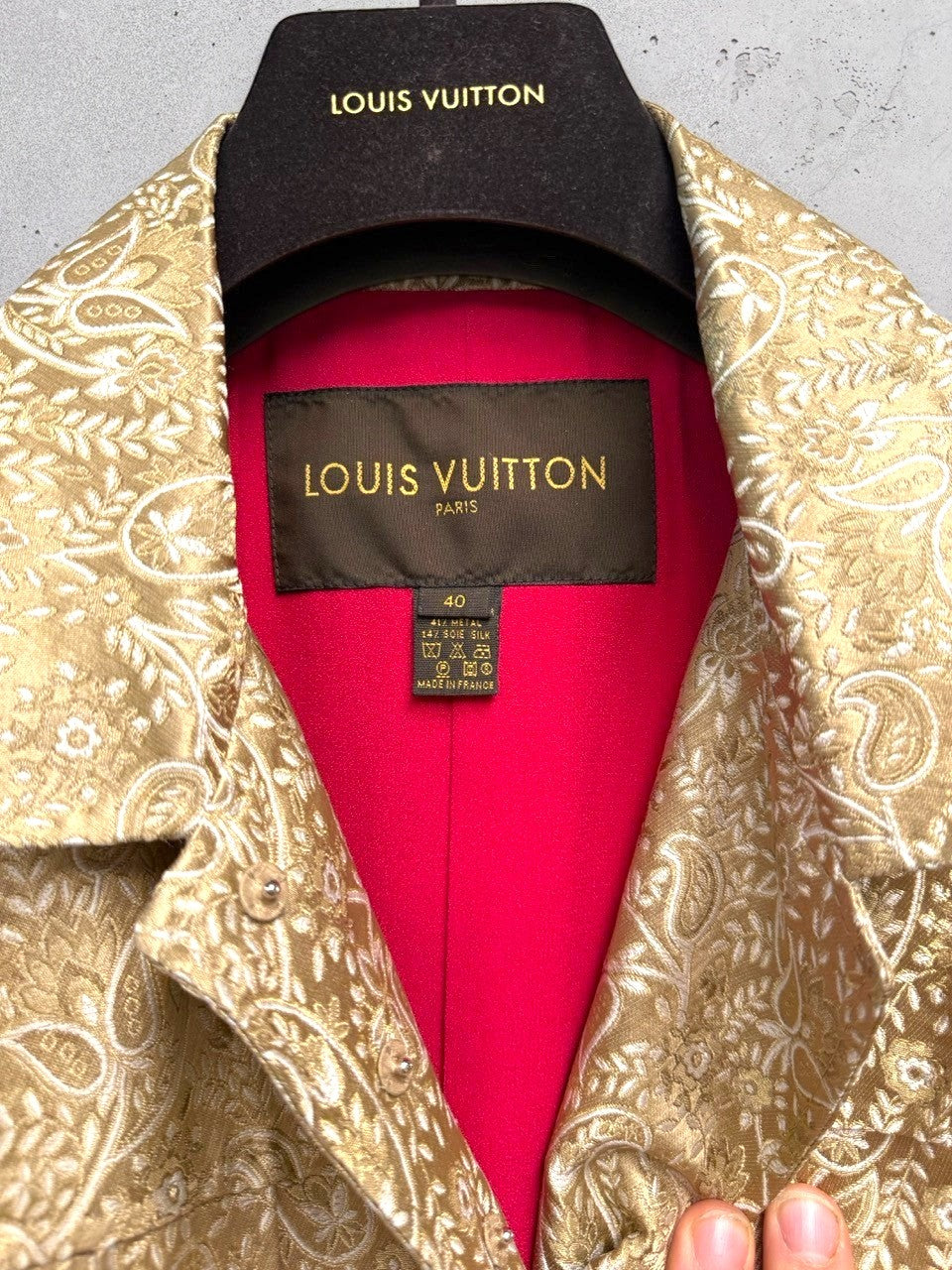 BERLIN VINTAGE CORNER Louis Vuitton gold brocade paisley jacket with fuchsia lining and ornate buttons.