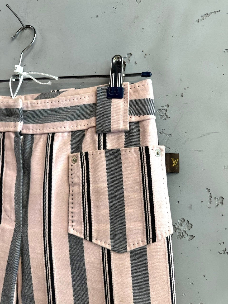 BERLIN VINTAGE CORNER Louis Vuitton pink, charcoal grey, and black striped cotton pants with a classic waistband and belt loops.