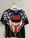 BERLIN VINTAGE CORNER black cotton t-shirt with graphic print featuring cartoon character, stars, stripes, and LOVE MOSCHINO logo.