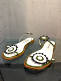 Manolo Blahnik flat sandals in white and black with flower appliques