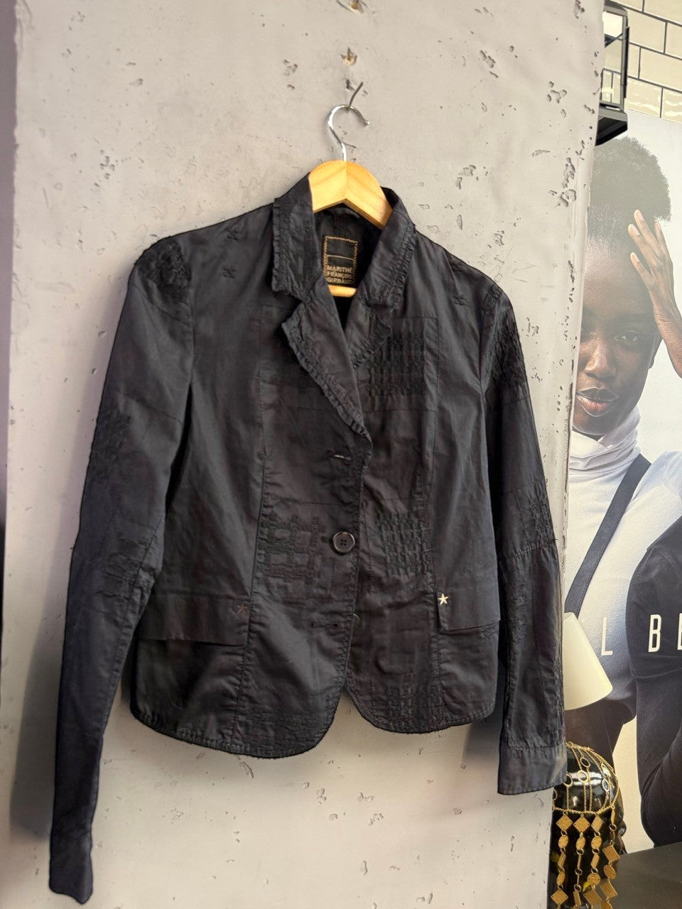 BERLIN VINTAGE CORNER black Marithé François Girbaud tailored blazer with tonal patchwork embroidery and star hardware.
