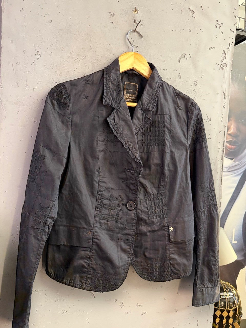 BERLIN VINTAGE CORNER black Marithé François Girbaud tailored blazer with tonal patchwork embroidery and star hardware.