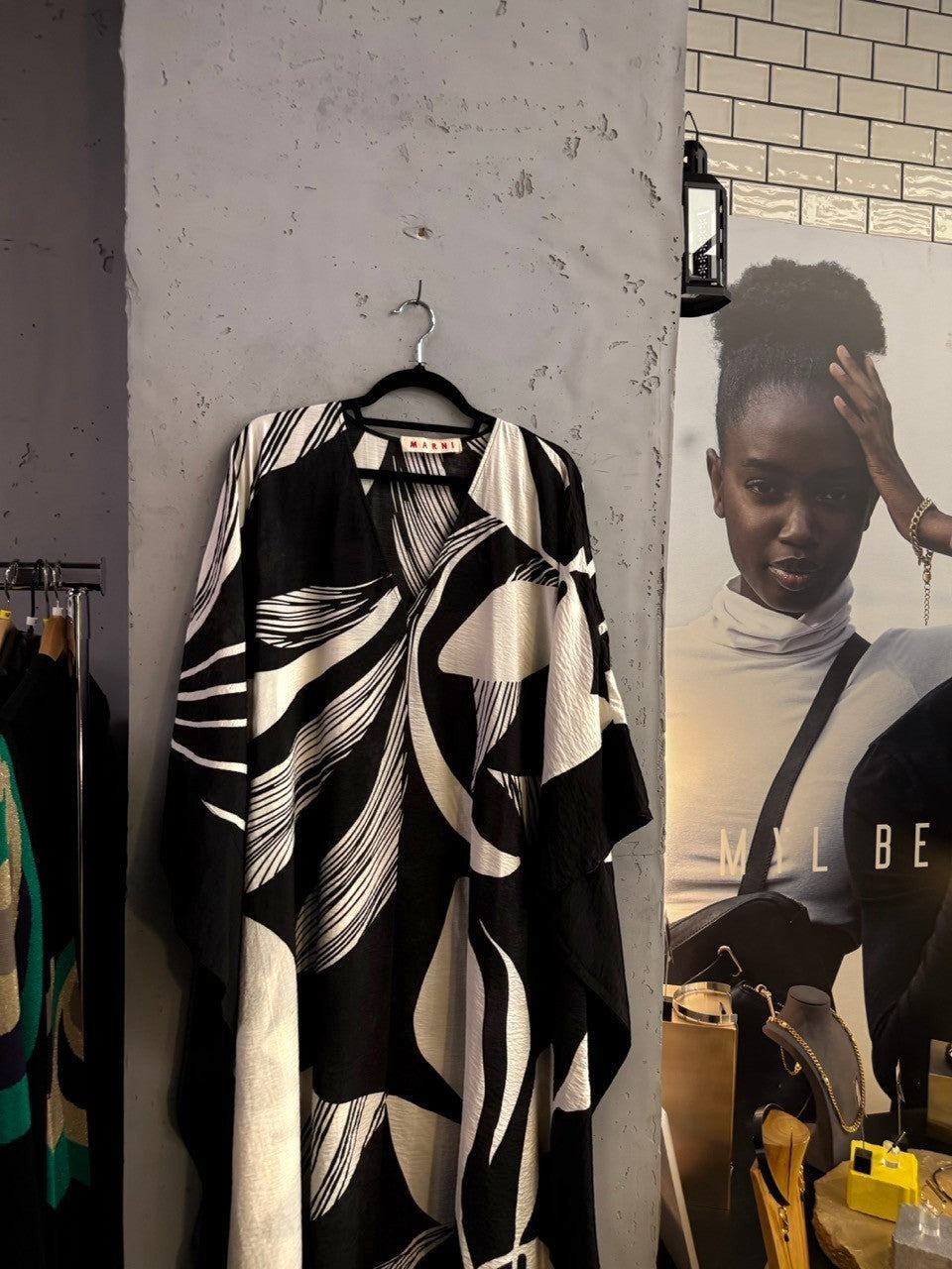 BERLIN VINTAGE CORNER Marni black and white abstract print V-neck kaftan dress hanging on a wall