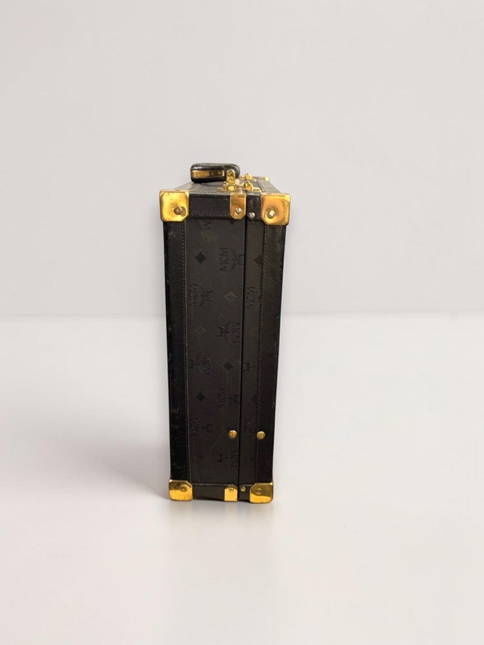 BERLIN VINTAGE CORNER MCM black leather hard shell briefcase with gold-tone corner protectors and monogram pattern