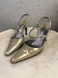 BERLIN VINTAGE CORNER metallic taupe leather pointed toe slingback heels with buckle strap.