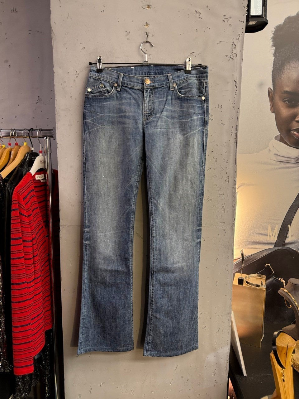 BERLIN VINTAGE CORNER mid-wash denim bootcut jeans with whiskering and fading. Comfortable mid-rise waist, belt loops, button and zip fly.