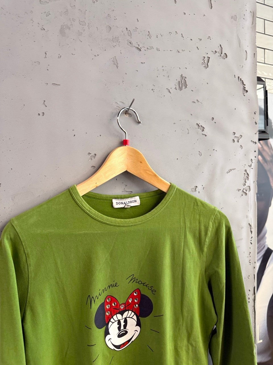 BERLIN VINTAGE CORNER lime green long sleeve cotton blend t-shirt with Minnie Mouse graphic and rhinestone bow.